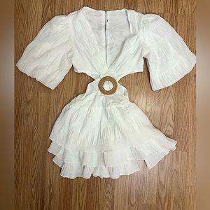 White Ruffled mini dress with bamboo circle detail front